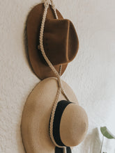 We all have a favourite hat (or two...) but nowhere to store them, so hang them in style when they're not in use with this chic boho macrame hat hanger. It's decor and practicality all in one! Made on a dowel rod.
