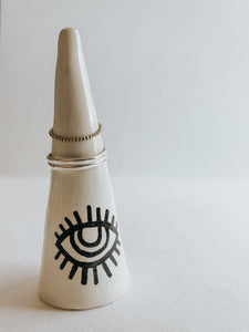 Store and display your favourite rings with this All Seeing Eye ring cone. It's such a beautiful addition to your space, adding a touch magic! Made with air dry clay and sealed with high gloss coating.