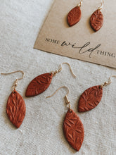 Handmade burnt terracotta polymer clay dangle leaf earrings with gold nickel free jewellery components.