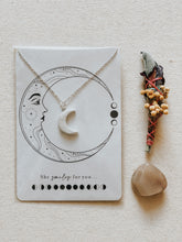 Crescent Moon pendant with mini floral smudge stick and crystals, all cleansed and charged under the Full Moon light.