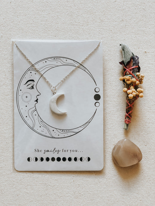 Crescent Moon pendant with mini floral smudge stick and crystals, all cleansed and charged under the Full Moon light.