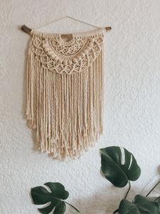 A beautiful half moon design using soft single twist cotton rope on a treated piece of driftwood. Perfect for an office or entrance hallway.