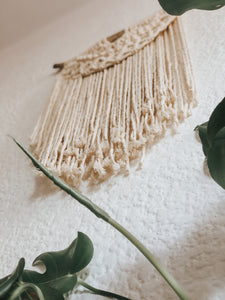 A beautiful half moon design using soft single twist cotton rope on a treated piece of driftwood. Perfect for an office or entrance hallway.