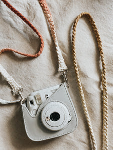 Hand-dyed macrame camera straps, perfect for a polaroid camera! It adds a fun touch and makes it easy and convenient to carry your camera around while snapping your photos. 