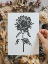 The process starts with a paper drawing that is then transferred to a Lino sheet and carefully hand carved by me, using special tools. Once the carving work is done, a water-based ink is rolled onto the print and then printed onto a sheet of paper. The outcome is rather charming! This elegant sunflower print can be framed, pegged to a line/meshboard, used in journaling or sent as a gift to a friend. 