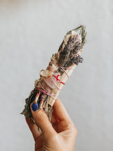 Floral smudge stick with rosemary, hibiscus, lavender, palo santo and a small rose quartz crystal. Great for cleaning negative energy and inviting positivity, love, protection and creativity into your space.
