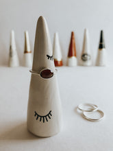 Store and display your favourite rings with this Sleeping Eyes ring cone. It's such a beautiful addition to your space, adding a touch magic! Made with air dry clay and sealed with high gloss coating to make it water resistant.