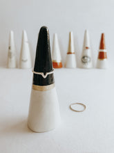 Store and display your favourite rings with this Black Tip ring cone. It's such a beautiful addition to your space, adding a touch magic! Made with air dry clay, painted with black and gold acrylic paint and sealed with a high gloss coating to make it water resistant.