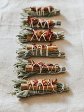 Smudging is an ancient ritual practiced by indigenous people, that involves the burning of medicinal or sacred plants to dispel negativity and raise vibrations. Each bundle contains sage, rosemary, cinnamon, rose petals and is carefully handmade by myself with fresh herbs, foraged flowers and natural cotton rope.