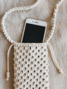 The perfect bag for walking around at a farmers market, catching some sun on a beach day or a night out with friends without lugging around a big bag filled with everything you don't need. Whatever the occasion, this phone pouch is sure to make life a little simpler.