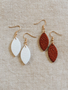 Handmade polymer clay dangle leaf earrings with gold nickel free jewellery components.