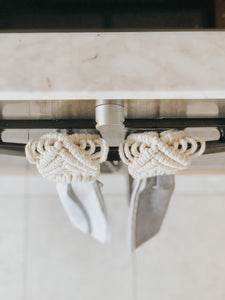 Enjoy the convenience of having a hand towel securely at the ready while keeping busy in the kitchen as well as adding to the decor of your space.   This hanger doubles up as a scarf hanger too. Keep your scarfs organised and looking fancy by folding this macrame hanger over the bar in your cupboard. I love saying this... but it's decor and practicality all in one!