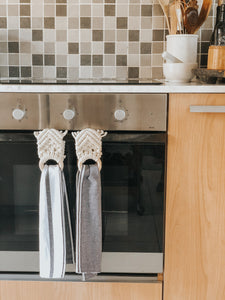 Enjoy the convenience of having a hand towel securely at the ready while keeping busy in the kitchen as well as adding to the decor of your space.   This hanger doubles up as a scarf hanger too. Keep your scarfs organised and looking fancy by folding this macrame hanger over the bar in your cupboard. I love saying this... but it's decor and practicality all in one!