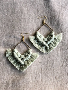 Hand-dyed pale mint green macrame earrings with bronze square charm and gold-plated earring hooks.