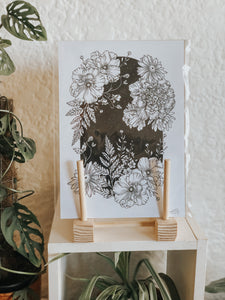 Black and white illustration of botanicals within a black starry night background. Pair your prints with other illustrations to create a whimsical story of your own.