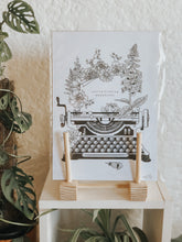 Black and white illustration of a typewriter surrounded with botanicals. The message reads "you're fucking beautiful." Pair your prints with other illustrations to create a whimsical story of your own.