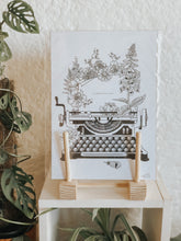 Black and white illustration of a typewriter surrounded with botanicals. Simply download, print, frame and enjoy!