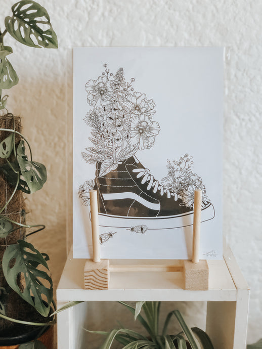 Black and white illustration of a pair of Vans surrounded with botanicals. Simply download, print, frame and enjoy!