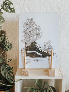 Black and white illustration of Vans surrounded with botanicals. Pair your prints with other illustrations to create a whimsical story of your own.
