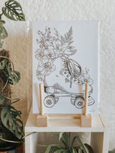 Black and white line work of a pair of roller skates surrounded with botanicals. Simply download, print, frame and enjoy!
