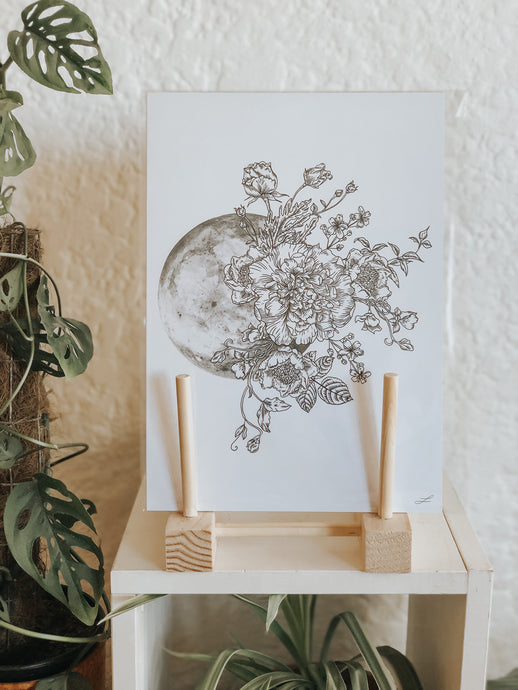 Black and white line work of the Moon and botanicals. Simply download, print, frame and enjoy!