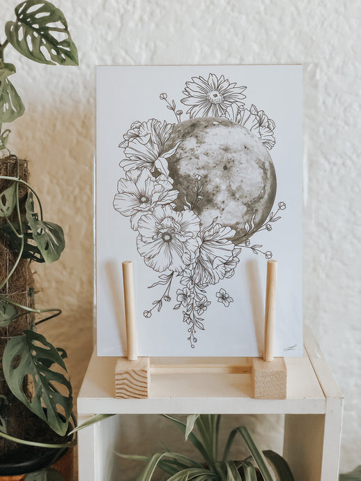 Black and white line work of the Moon and botanicals. Simply download, print, frame and enjoy!