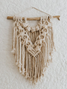 A small sweet and charming wall hanging that can instantly add some interest to that small space you have no idea what to do with. Pair it with some framed family photos or our art prints and create a truly unique wall that will make you feel good every time you walk past it. Made with single twist cotton rope on a treated piece of wood foraged in Cape Town.