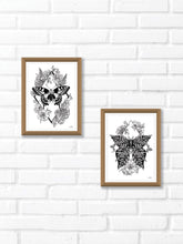 Black and white line work of a moth surrounded by botanicals. Simply download, print, frame and enjoy!