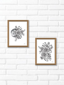 Black and white illustration of a Moon surrounded by botanicals. Pair your prints with other illustrations to create a whimsical story of your own.